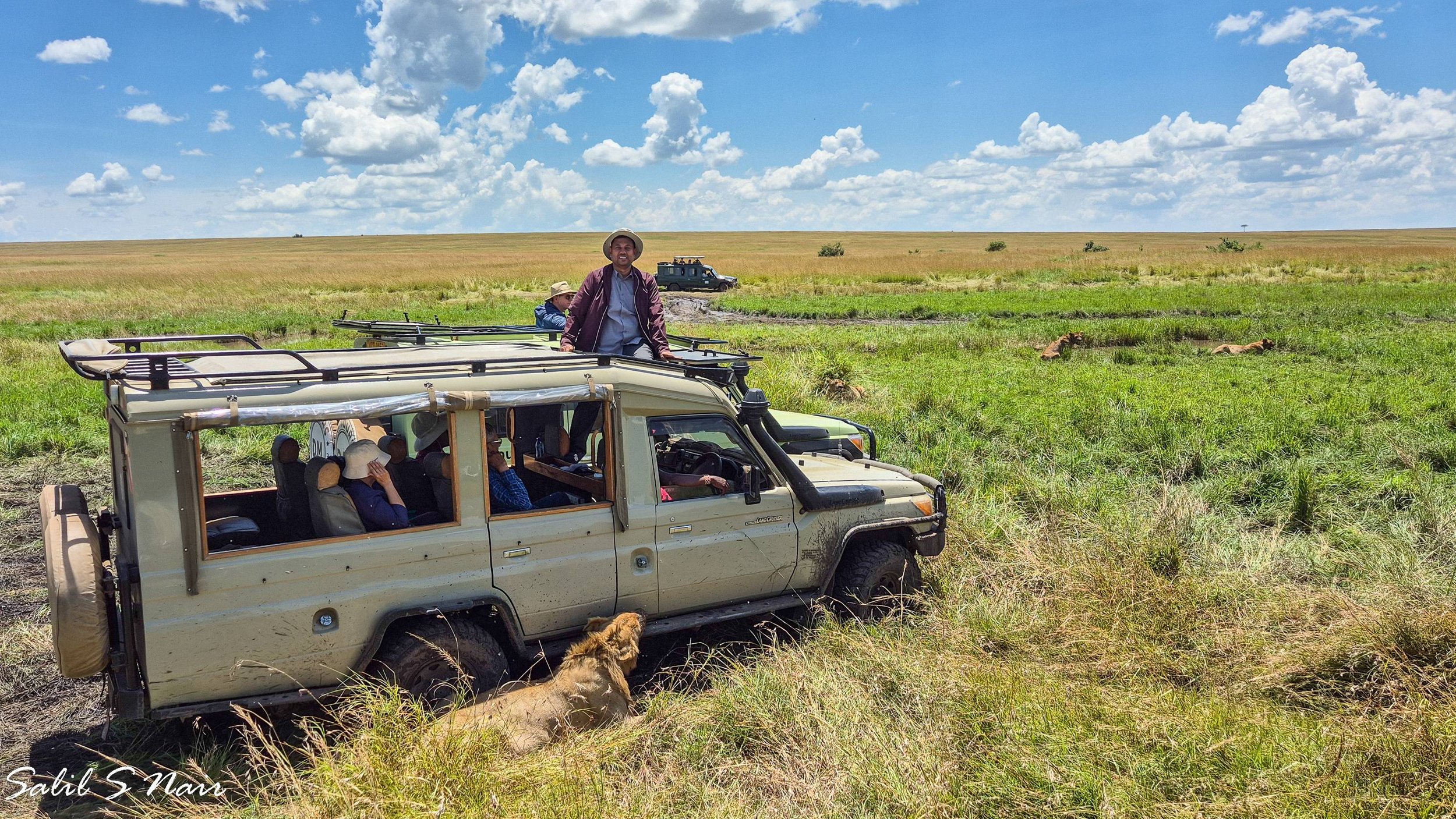 DSLR camera on jeep dashboard — Out of the Office by Salil Nair